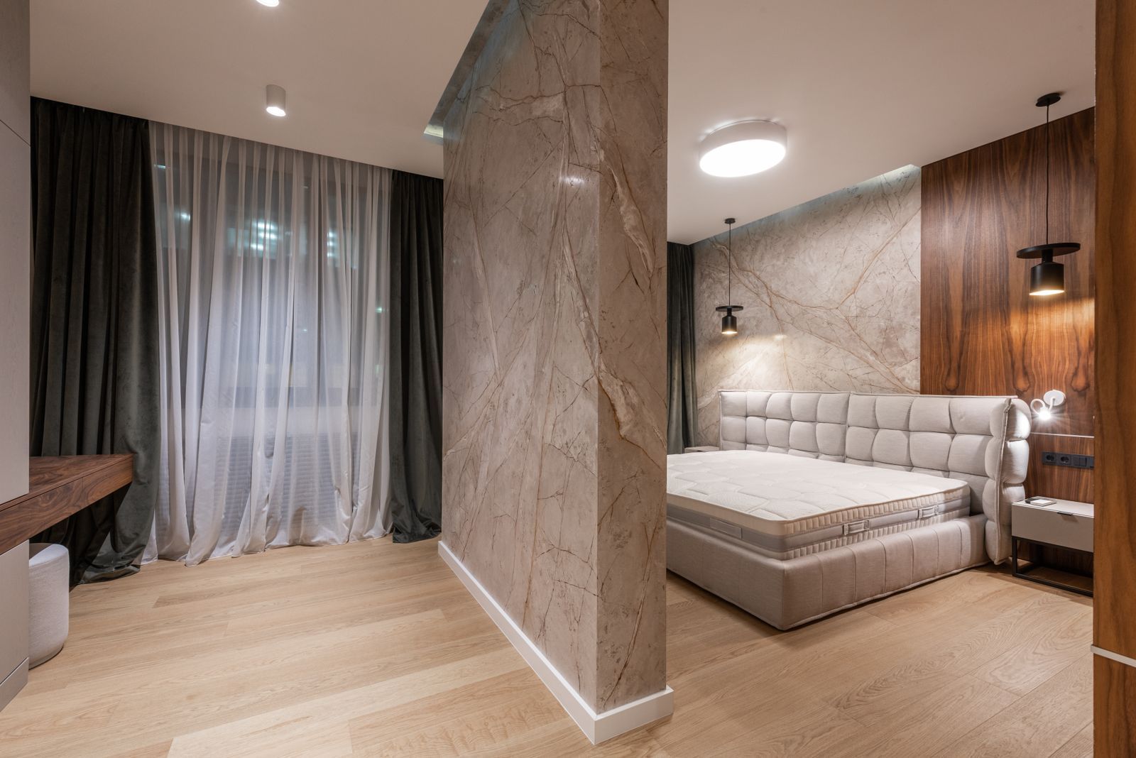 Bedroom with walnut wall panelling and fitted wardrobe
