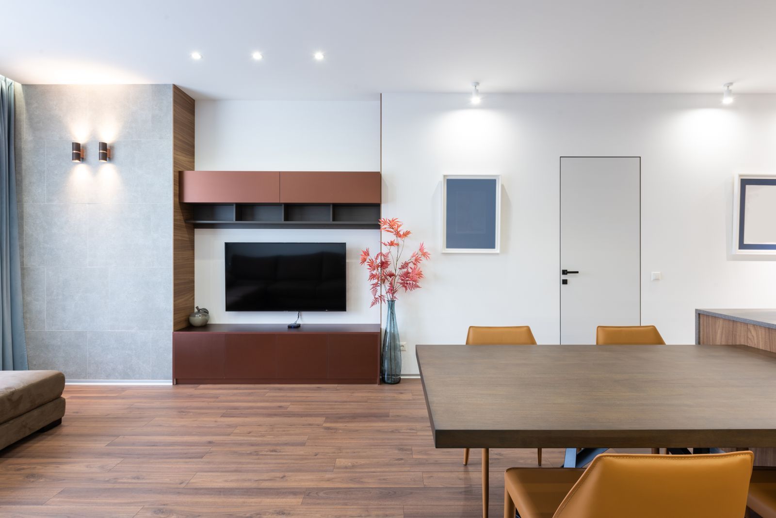Built-in media wall with walnut panels